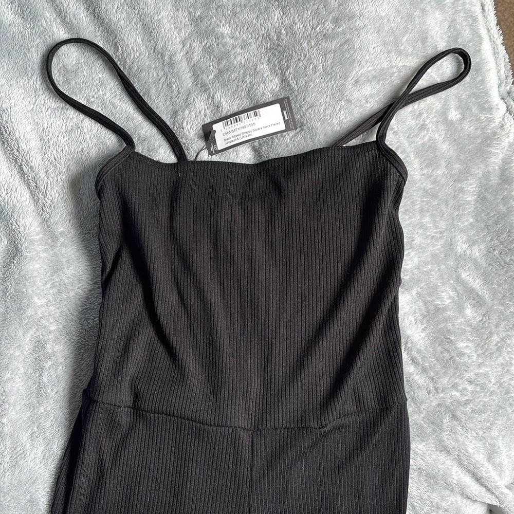 PrettyLittleThing Black Ribbed Spaghetti Strap Romper